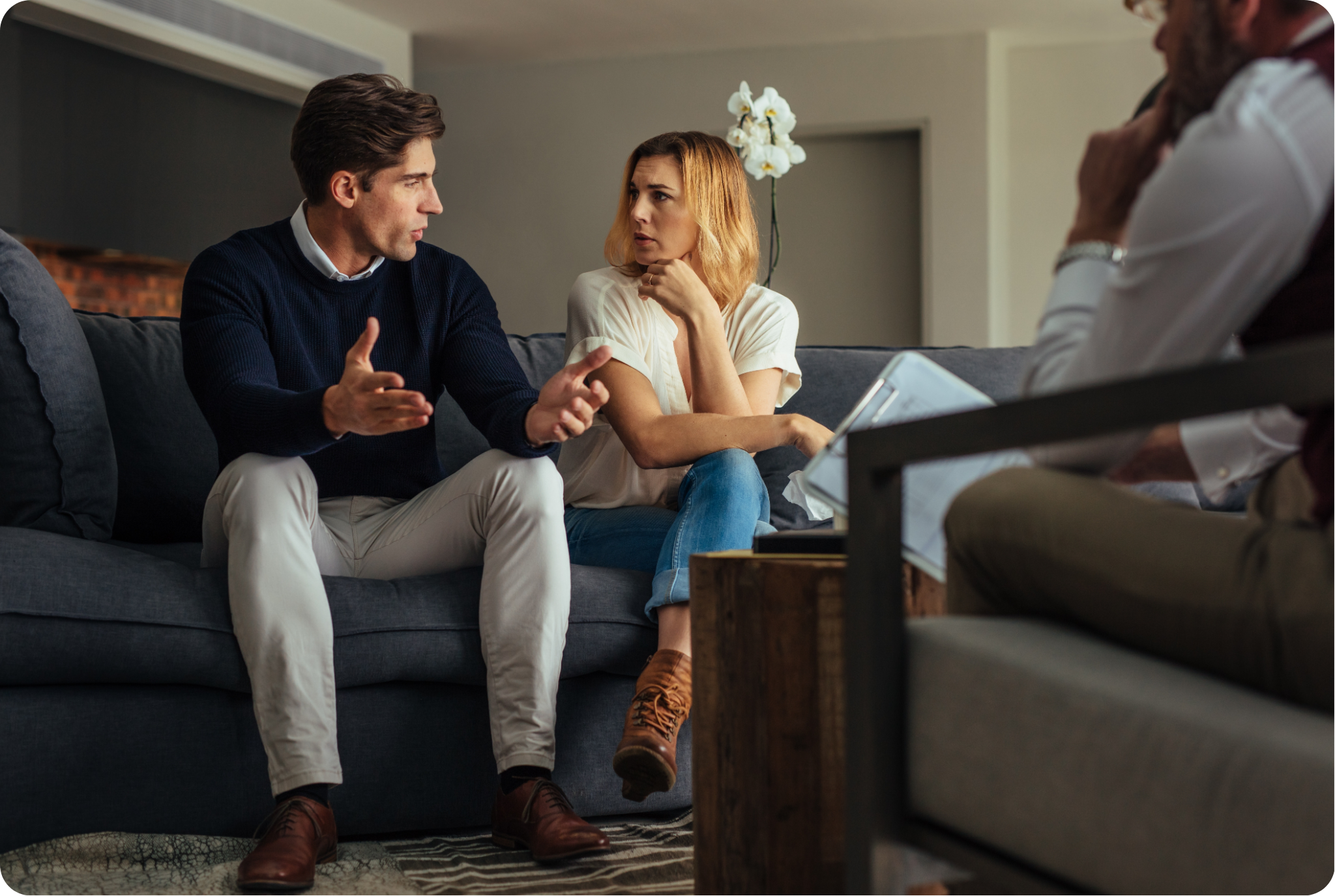 Therapist and client talking on a couch